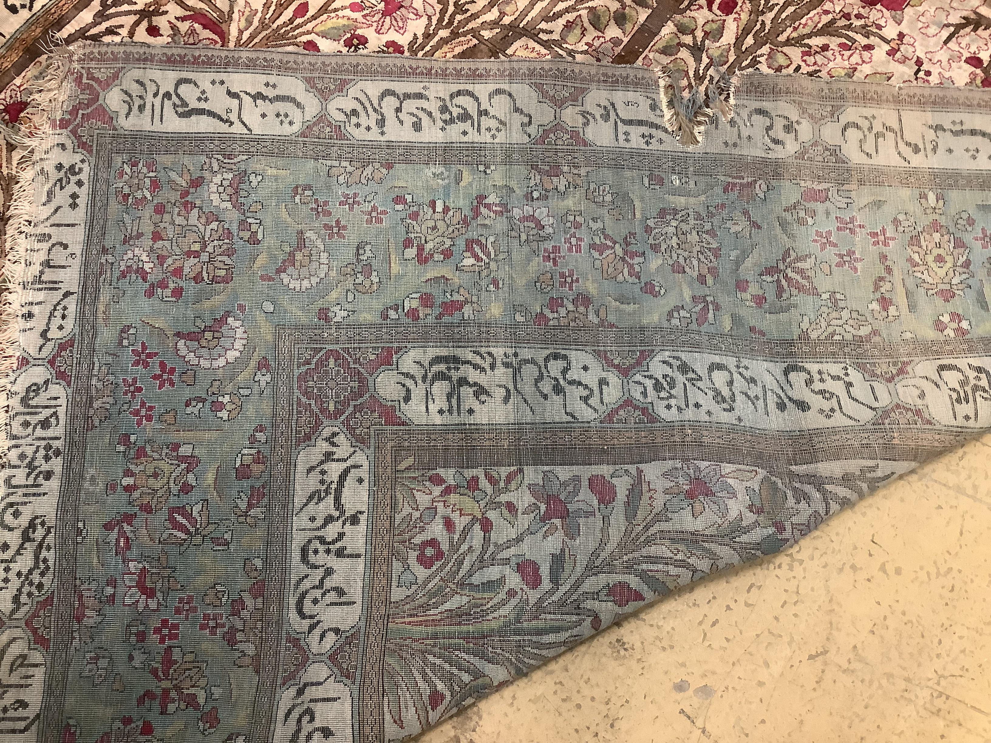 An antique Tabriz part silk rug, holed and worn, 198 x 136cm